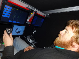 Winter generator mechanic, Steve Croft, inside the space flight simulator at Halley Research Station. Credit: Alexander Finch