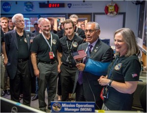 NASA Administrator Charles Bolden talks to the New Horizons team after they received confirmation from the spacecraft that it had successfully completed the flyby of Pluto, Tuesday, July 14, 2015 in the Mission Operations Center (MOC) of the Johns Hopkins University Applied Physics Laboratory (APL), Laurel, Maryland. Credit: NASA/Bill Ingalls