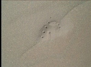 Laser-Induced Breakdown Spectrometer (LIBS) uses laser pulses to study sand scarp. Curiosity Mars Hand Lens Imager (MAHLI) took this image on February 2, 2016, Sol 1241  Credit: NASA/JPL-Caltech/MSSS 