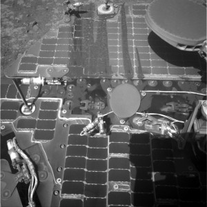This March 21, 2016, image from the navigation camera on NASA's Mars rover Opportunity shows streaks of dust or sand on the vehicle's rear solar panel after a series of drives during which the rover was pointed steeply uphill. The tilt and jostling of the drives affected material on the rover deck. Credit: NASA/JPL-Caltech 