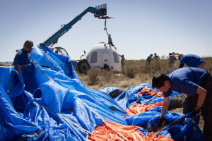 Members of the Blue Origin team recover the Crew Capsule after its fifth successful flight and soft landing. Credit: Blue Origin