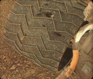 Curiosity Mastcam Left image of rover wheel damage, taken on Sol 1403 July 17, 2016. Credit: NASA/JPL-Caltech/MSSS 